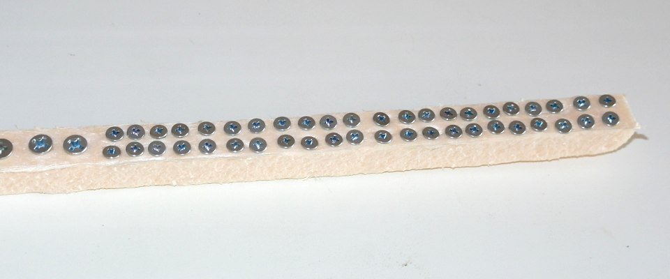 Screws fixed on a piece of polystyrene foam for painting